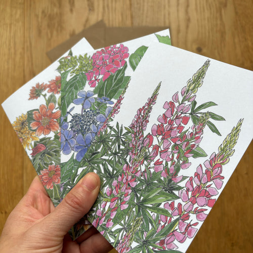 A set of three cards with botanical illustrations by Alice Savery artist, lupins, hydrangeas and dahilas in the height of summer by Alice Draws the Line
